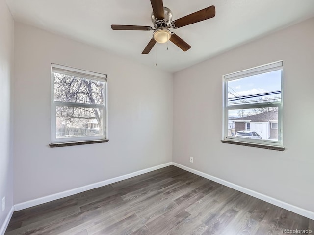 unfurnished room featuring dark hardwood / wood-style floors and ceiling fan