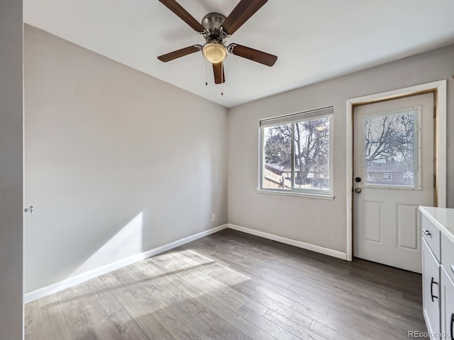 entryway with ceiling fan and hardwood / wood-style floors