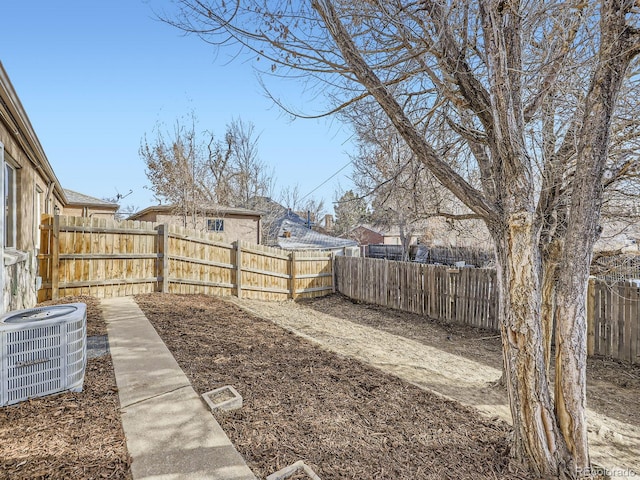 view of yard with central AC unit