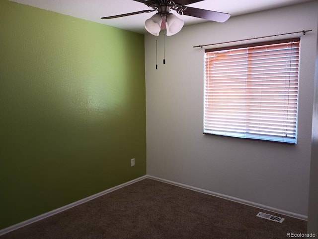 unfurnished room featuring a wealth of natural light, ceiling fan, and carpet flooring