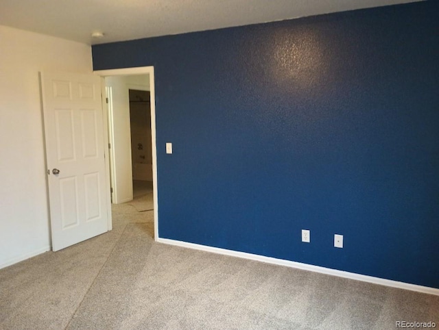 empty room with light colored carpet