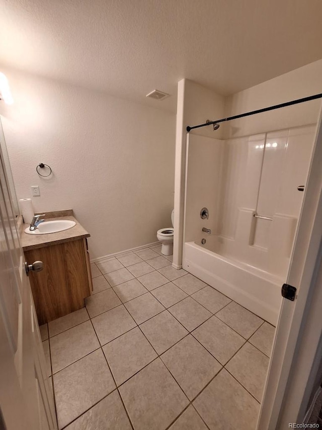 full bathroom featuring toilet, shower / bathing tub combination, a textured ceiling, vanity, and tile patterned flooring