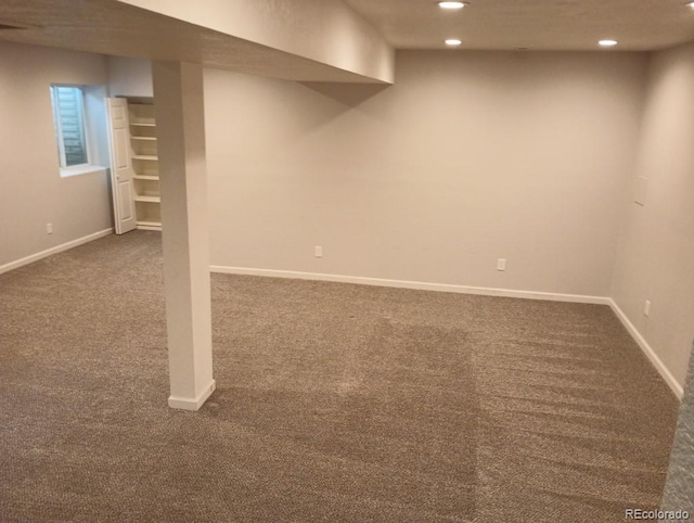 basement with dark carpet