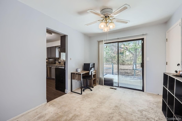 home office featuring baseboards, visible vents, carpet floors, and ceiling fan