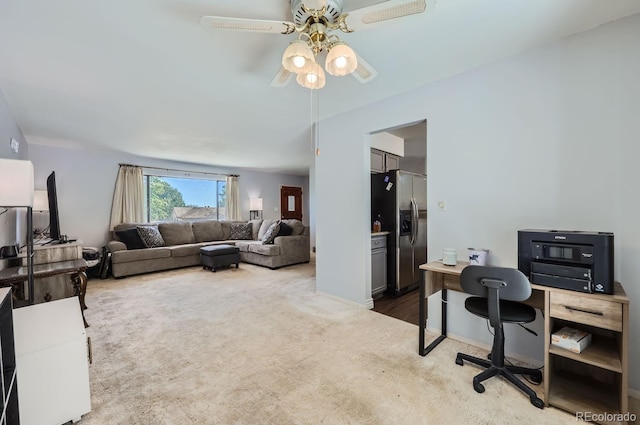 office area with carpet and a ceiling fan