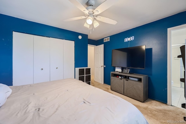 bedroom with visible vents, carpet, a closet, and ceiling fan