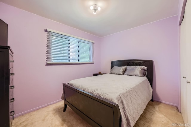 carpeted bedroom with baseboards