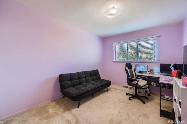 carpeted office space with baseboards