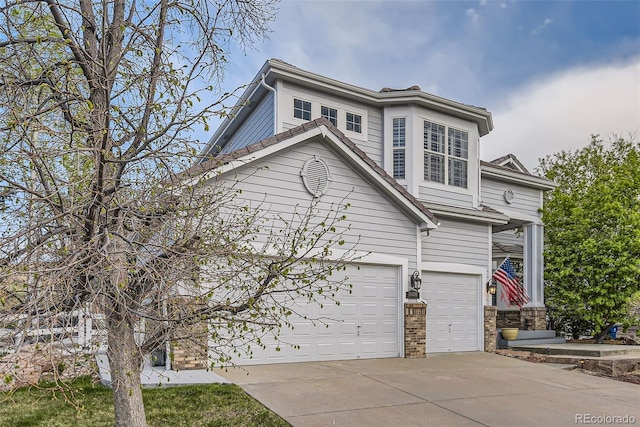 view of front of property with a garage and driveway