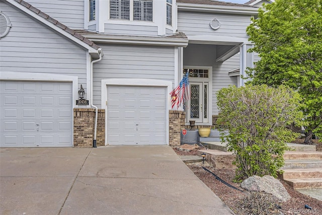 garage with concrete driveway