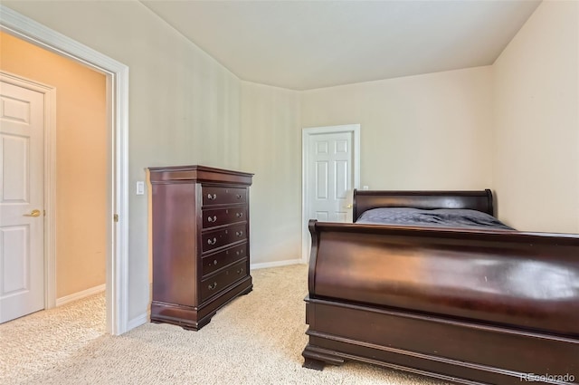 bedroom featuring baseboards and carpet flooring