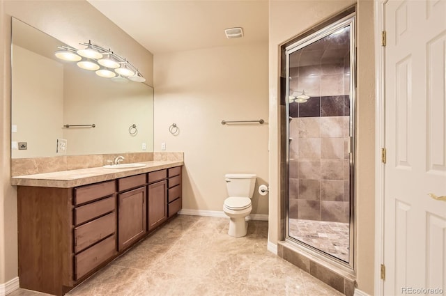 full bathroom featuring vanity, tile patterned floors, toilet, and a shower stall