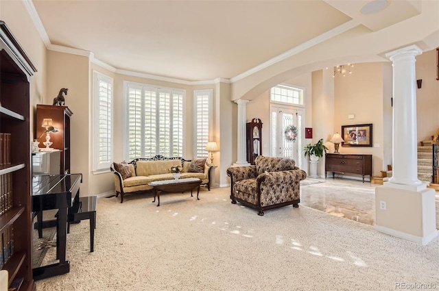 sitting room featuring crown molding, arched walkways, carpet, baseboards, and decorative columns