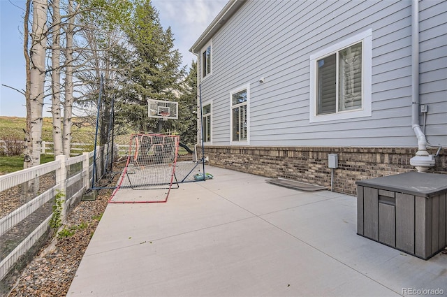 view of patio featuring fence