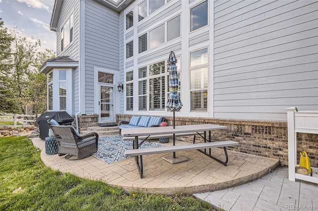 view of patio featuring fence and grilling area