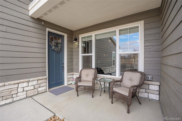 property entrance with stone siding