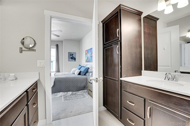 bathroom featuring vanity, tile patterned floors, and connected bathroom