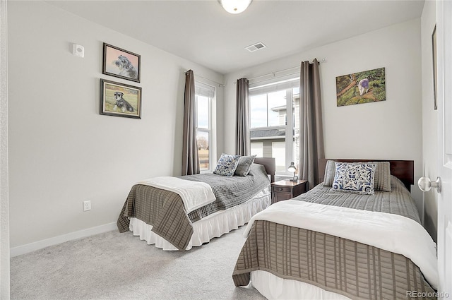 bedroom with carpet, visible vents, and baseboards