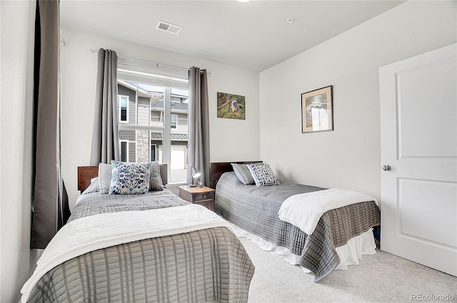 bedroom featuring visible vents and carpet