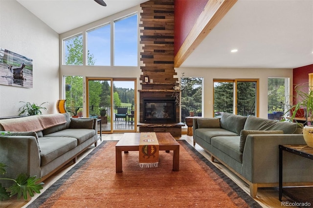 4230 S Meadow Brook Ln, Evergreen, CO 80439 - living room with high vaulted ceiling, a fireplace, plenty of natural light, and recessed lighting