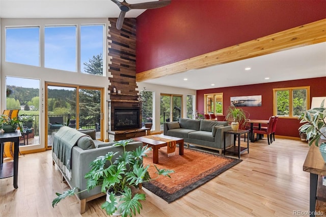 4230 S Meadow Brook Ln, Evergreen, CO 80439 - living area featuring plenty of natural light, beamed ceiling, light wood finished floors, recessed lighting, and high vaulted ceiling