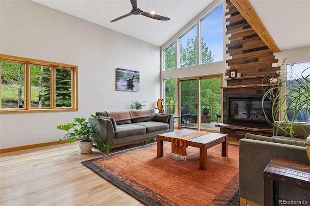 4230 S Meadow Brook Ln, Evergreen, CO 80439 - living area featuring high vaulted ceiling, plenty of natural light, baseboards, a ceiling fan, and wood finished floors