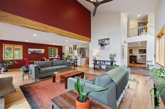 4230 S Meadow Brook Ln, Evergreen, CO 80439 - living area with a ceiling fan, wood finished floors, a towering ceiling, and recessed lighting