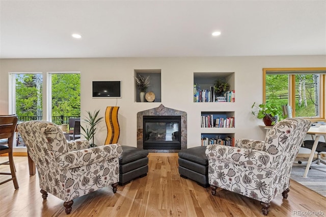 4230 S Meadow Brook Ln, Evergreen, CO 80439 - living room with a tiled fireplace, plenty of natural light, wood finished floors, and recessed lighting