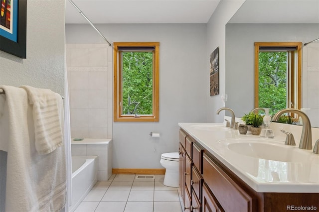 4230 S Meadow Brook Ln, Evergreen, CO 80439 - bathroom with plenty of natural light, tile patterned floors, double vanity, and toilet