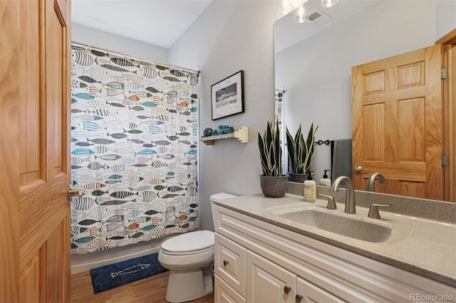 4230 S Meadow Brook Ln, Evergreen, CO 80439 - full bathroom featuring vanity, toilet, a shower with curtain, and wood finished floors