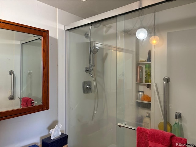 bathroom with a shower stall