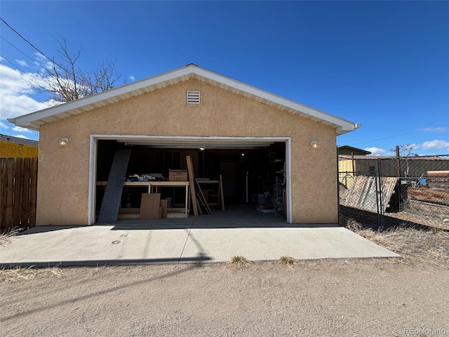 detached garage with fence