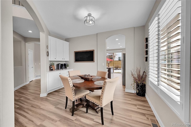 dining room featuring light hardwood / wood-style flooring