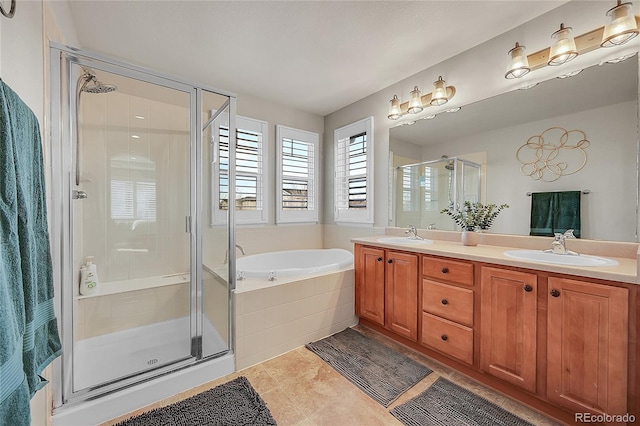 bathroom featuring vanity, plus walk in shower, and tile patterned flooring