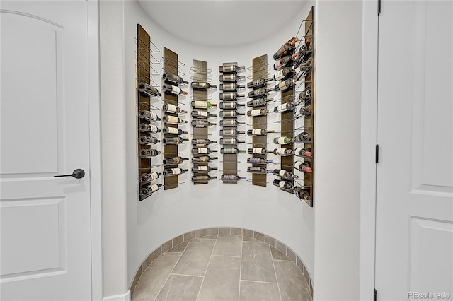 wine room with tile patterned floors