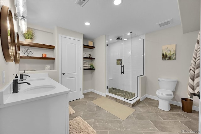 bathroom with toilet, vanity, and walk in shower