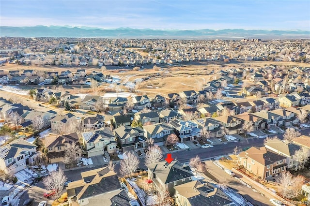 birds eye view of property with a mountain view