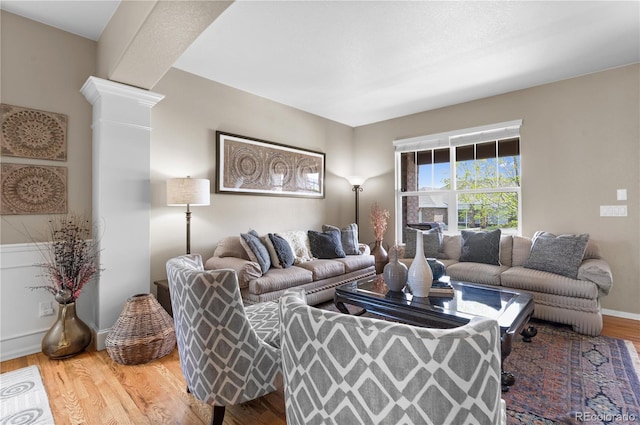 1852 E Sea Drift Dr, Windsor, CO 80550 - living room with wood finished floors and decorative columns