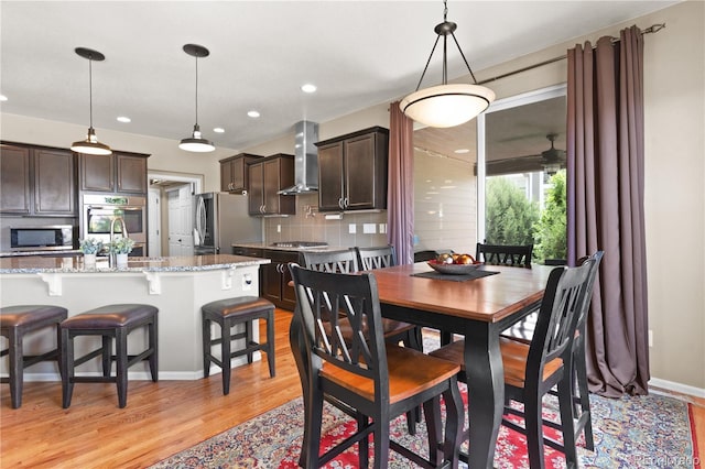 1852 E Sea Drift Dr, Windsor, CO 80550 - dining area featuring light wood-type flooring and recessed lighting