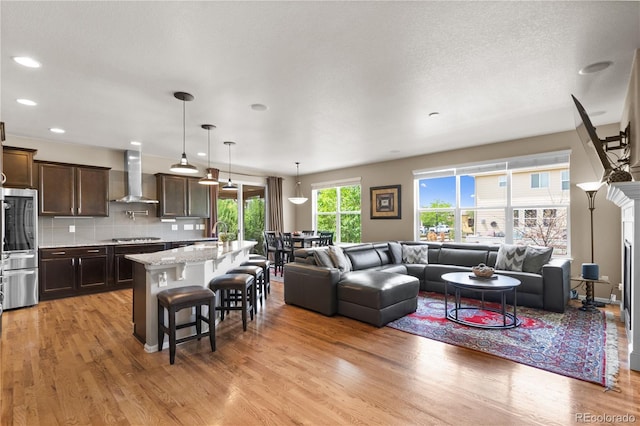 1852 E Sea Drift Dr, Windsor, CO 80550 - living area featuring light wood-style flooring and recessed lighting