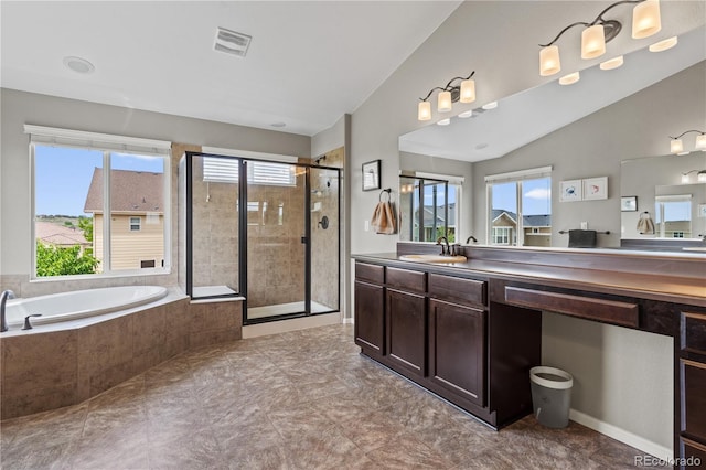 1852 E Sea Drift Dr, Windsor, CO 80550 - full bath featuring a shower stall, vanity, a garden tub, and lofted ceiling