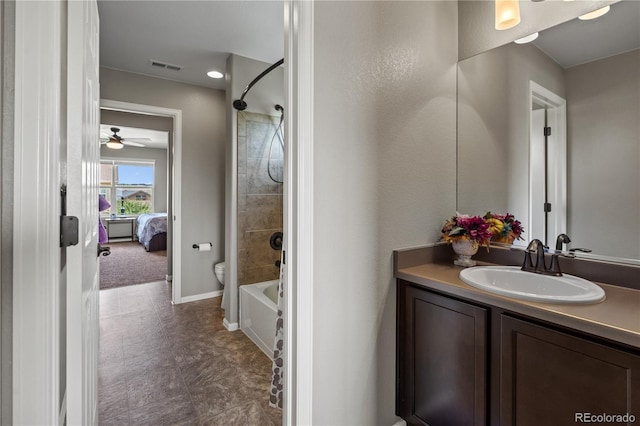 1852 E Sea Drift Dr, Windsor, CO 80550 - ensuite bathroom with vanity, bathing tub / shower combination, tile patterned floors, and ceiling fan