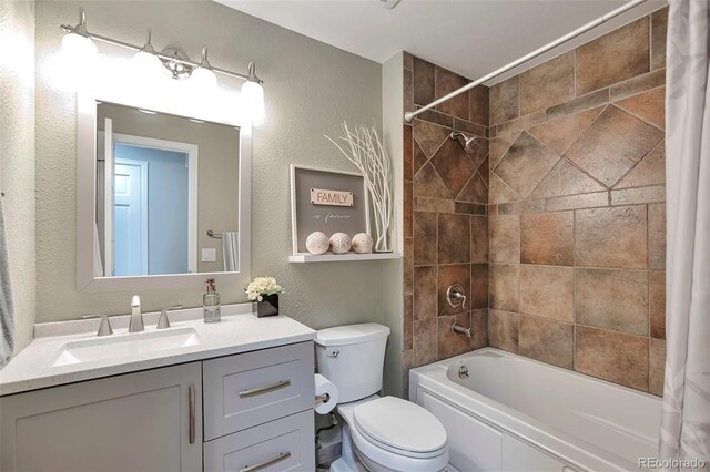 8262 Otis Ct, Arvada, CO 80003 - full bathroom featuring a textured wall, shower / bath combo with shower curtain, and vanity