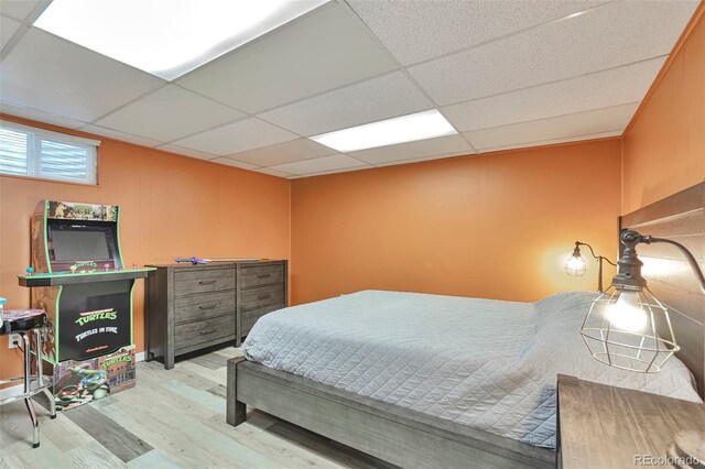 8262 Otis Ct, Arvada, CO 80003 - bedroom with wood finished floors and a drop ceiling