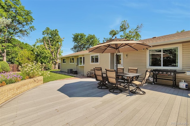8262 Otis Ct, Arvada, CO 80003 - wooden terrace featuring outdoor dining space and a grill