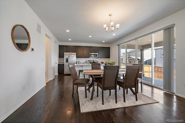 dining space with baseboards, visible vents, dark wood-style floors, a chandelier, and recessed lighting