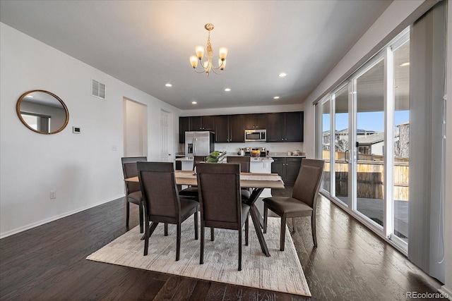 dining space featuring baseboards, visible vents, dark wood-type flooring, a chandelier, and recessed lighting