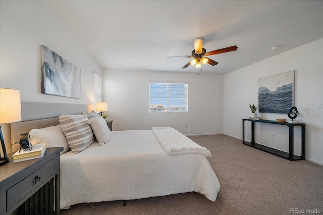 bedroom featuring carpet, baseboards, and a ceiling fan