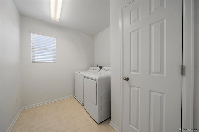 laundry room featuring washer and dryer, laundry area, and baseboards