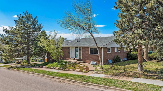 295 E Amherst Ave, Englewood, CO 80113 - ranch-style home featuring brick siding, a front lawn, and roof with shingles